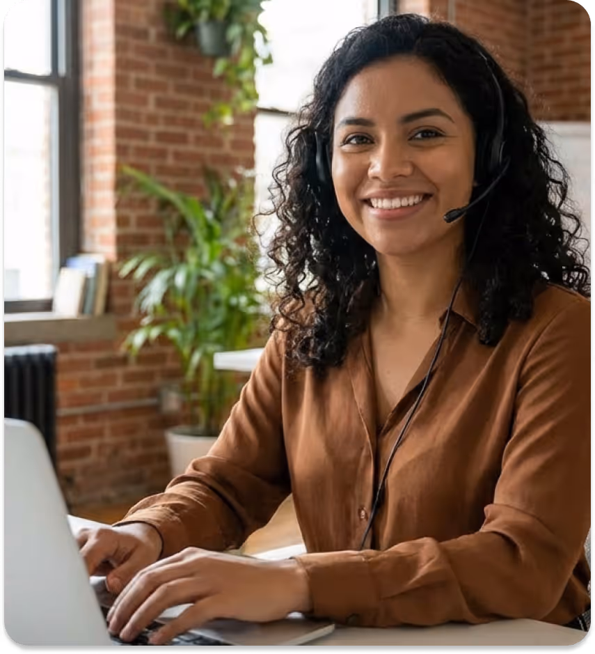 Smiling woman wearing headset and teal shirt with crossed arms next to HIPAA compliant emblem.