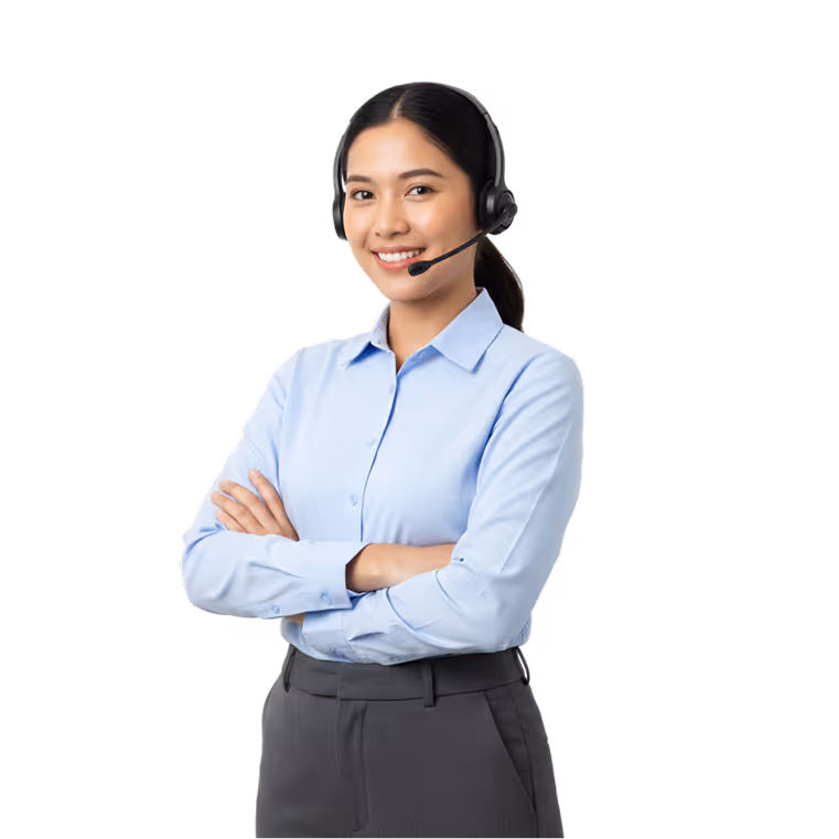 Smiling customer service representative wearing a headset and light blue shirt with arms crossed.