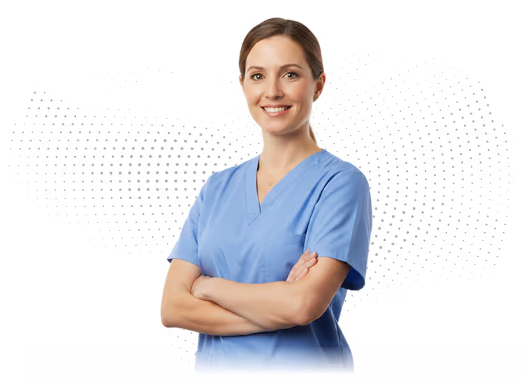 Smiling female healthcare professional in blue scrubs with arms crossed.