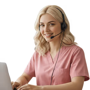 Smiling woman in pink medical scrubs with headset working on a laptop, suggesting virtual medical receptionist.