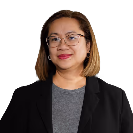 Smiling woman with shoulder-length hair, glasses, and black blazer on a black background.