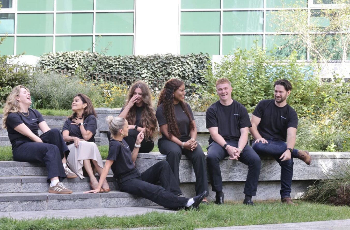 The Resolutiion team sitting together outdoors