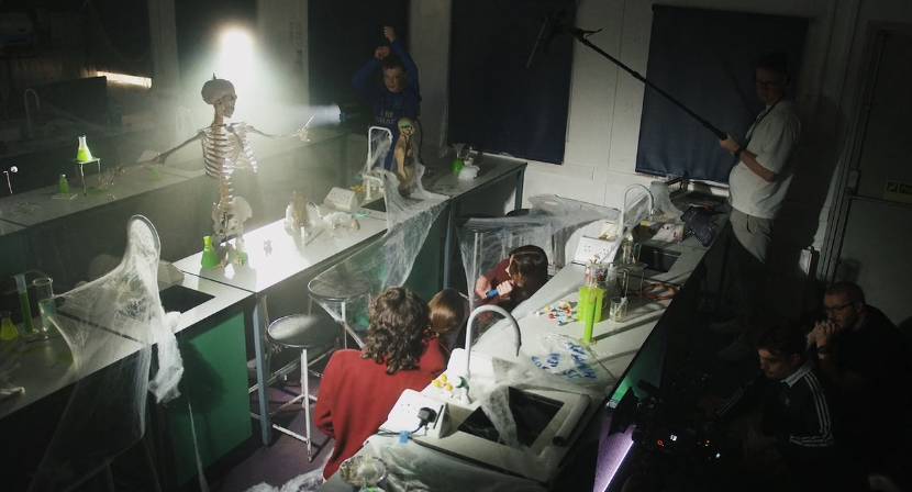 students being filmed by Feel Good Films in a science classroom
