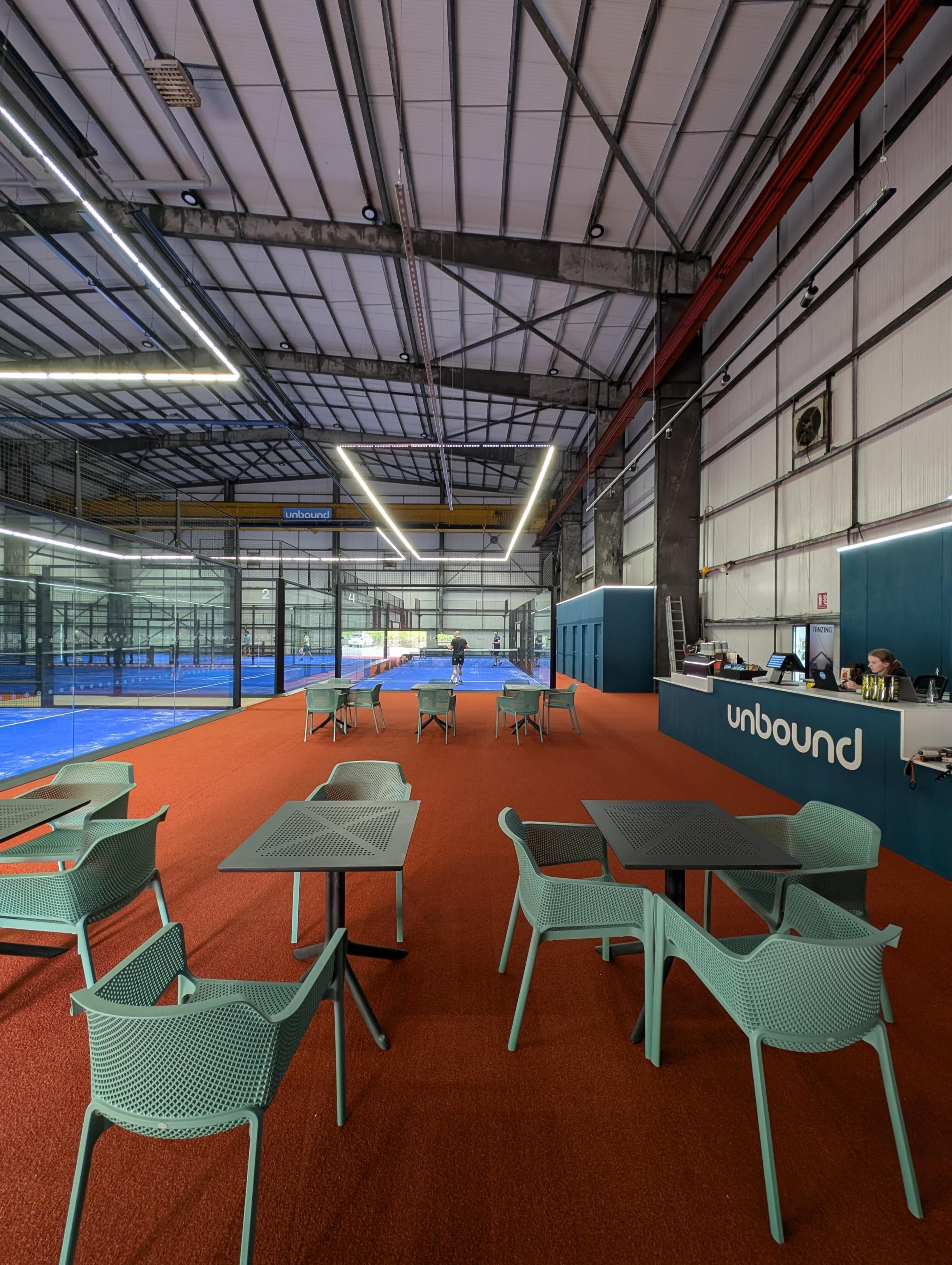 Unbound padel cafe and shop overlooking padel courts
