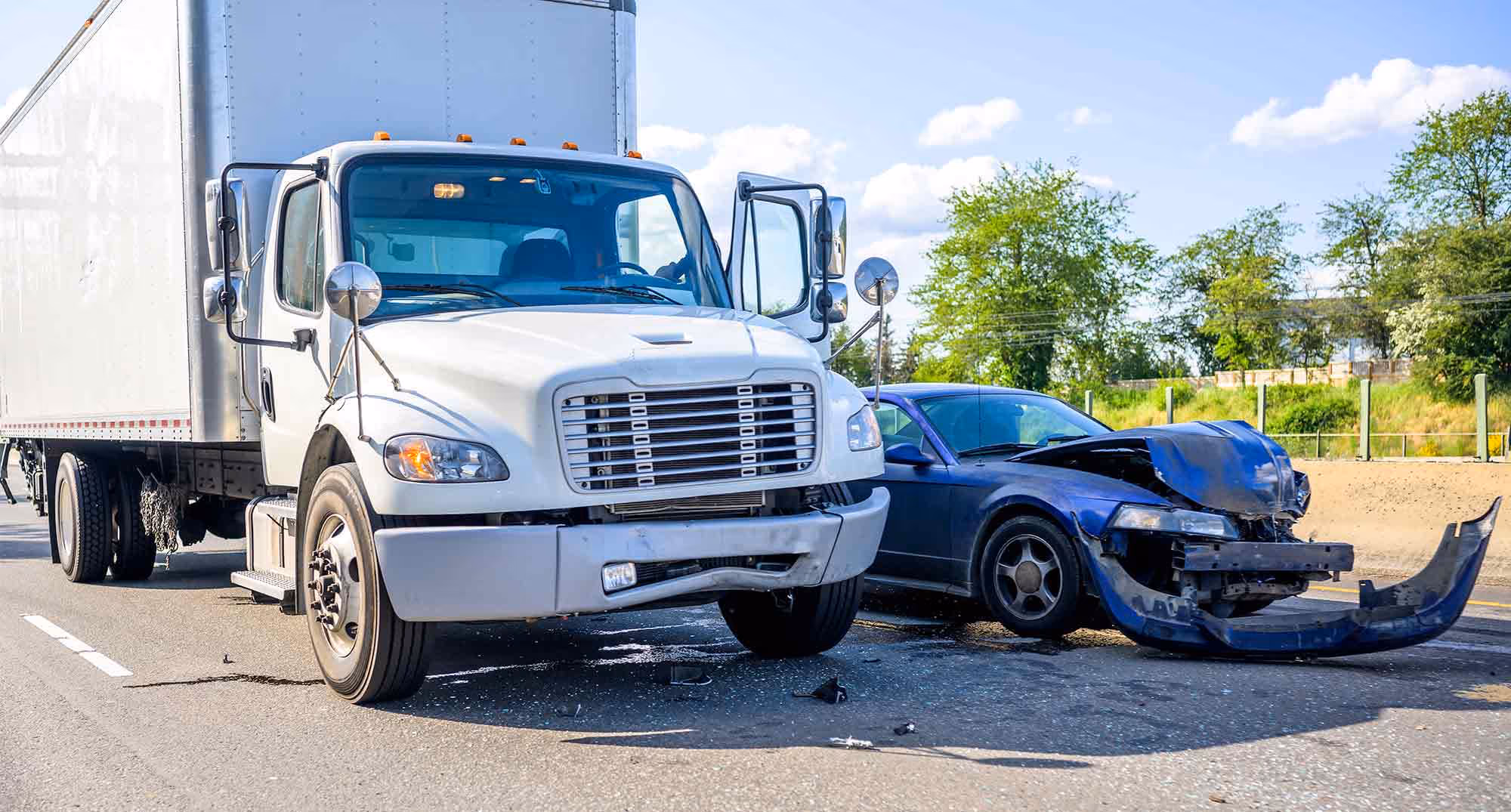 A semi and a car have damage caused by distracted driving