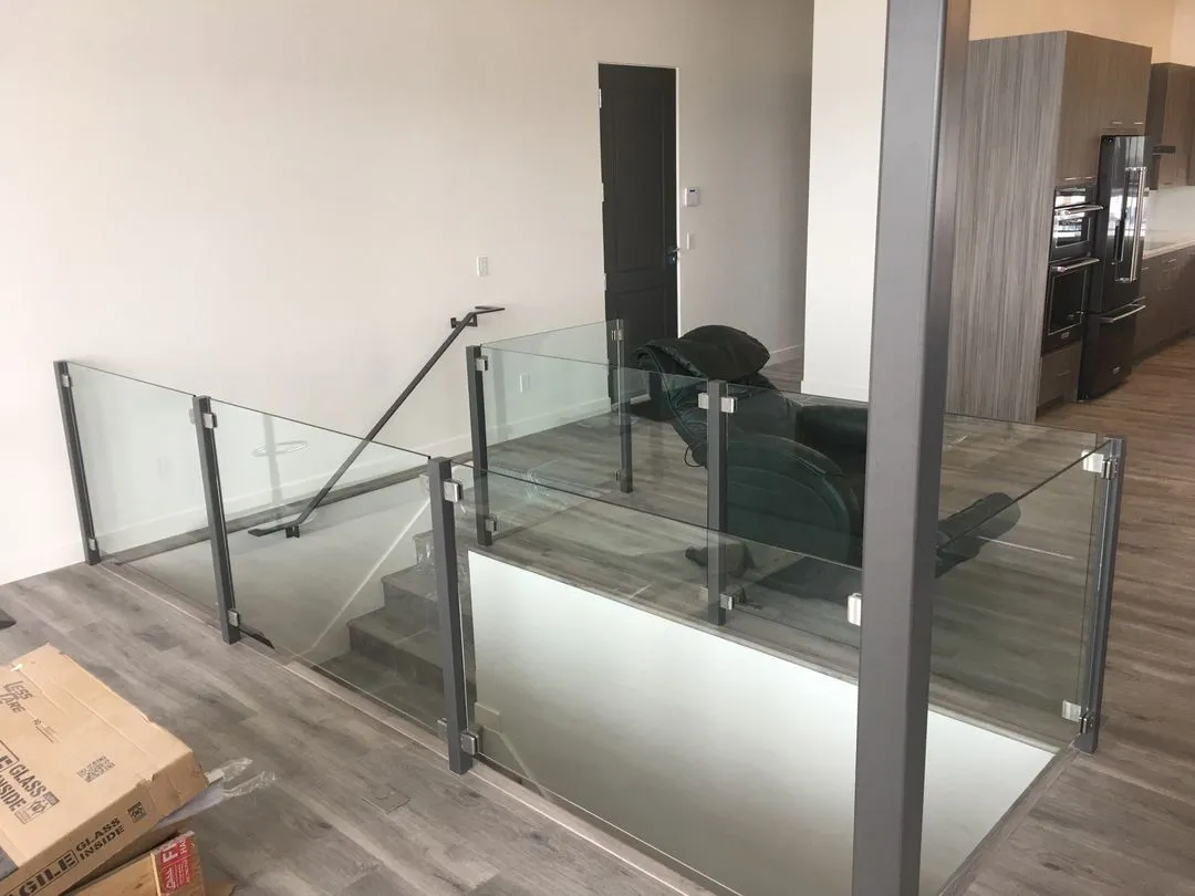 Frameless glass railing installation on a staircase in Salt Lake City Utah