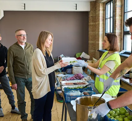 Volunteers distribute meals through South Florida Horsemen’s Group outreach program.