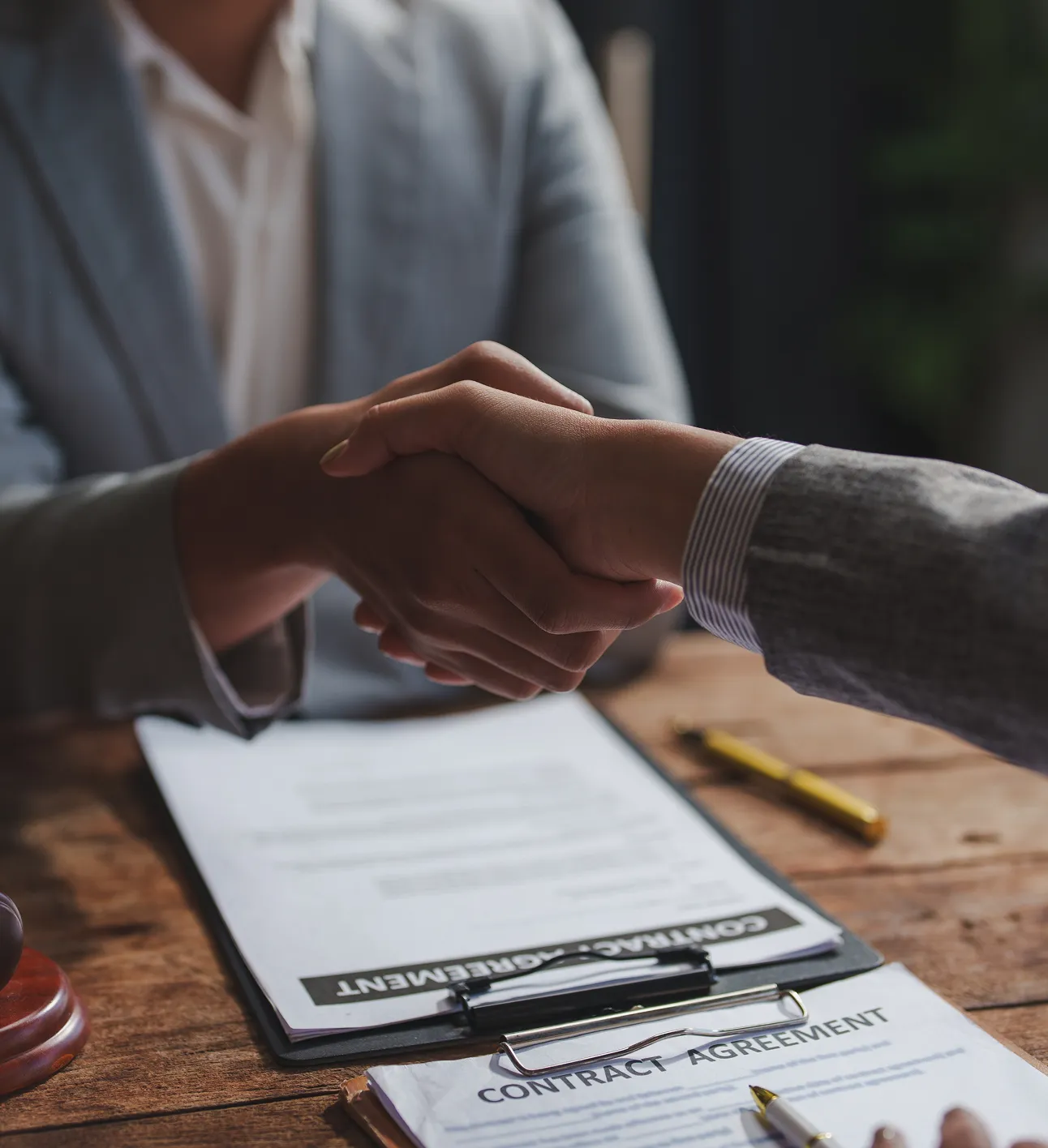 Handshake over agreement reflecting partnerships within South Florida Horsemen’s Group.