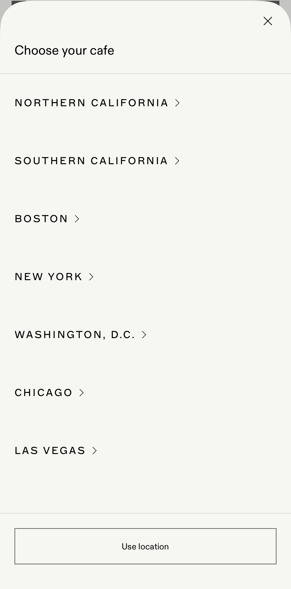 Menu to choose a cafe location with options including Northern California, Southern California, Boston, New York, Washington D.C., Chicago, Las Vegas, and a button to use location.