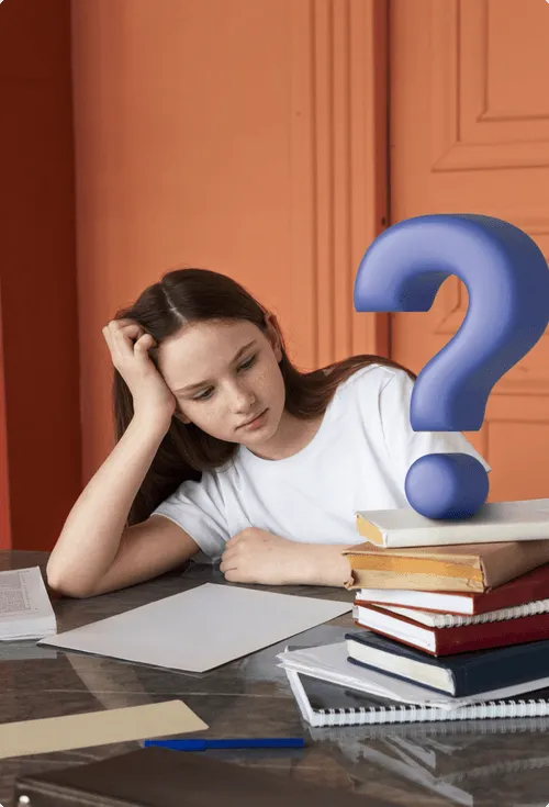Young girl resting her head on one hand, looking thoughtfully at a blank sheet of paper with a stack of books and a large blue question mark beside her on the table.