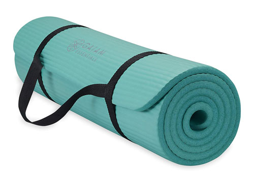 thick teal Pilates mat with carrying strap, rolled up.