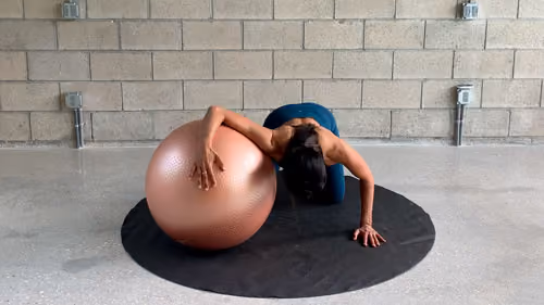 Chest stretch on Swiss ball for posture correction exercises