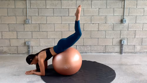 Glute strengthening exercise on Swiss ball with leg lift