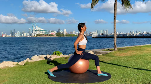 Hip flexor stretch on a stability ball to improve flexibility