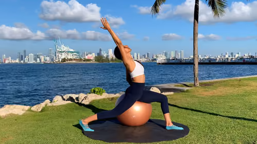 Hip flexor stretch with overhead reach on a stability ball