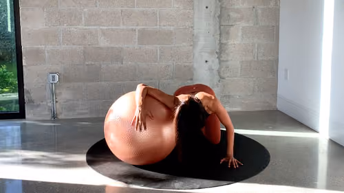 Kneeling chest stretch with a stability ball to open shoulders and improve posture