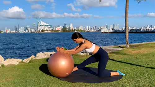 Hamstring stretch with a stability ball from a kneeling position with front leg extended
