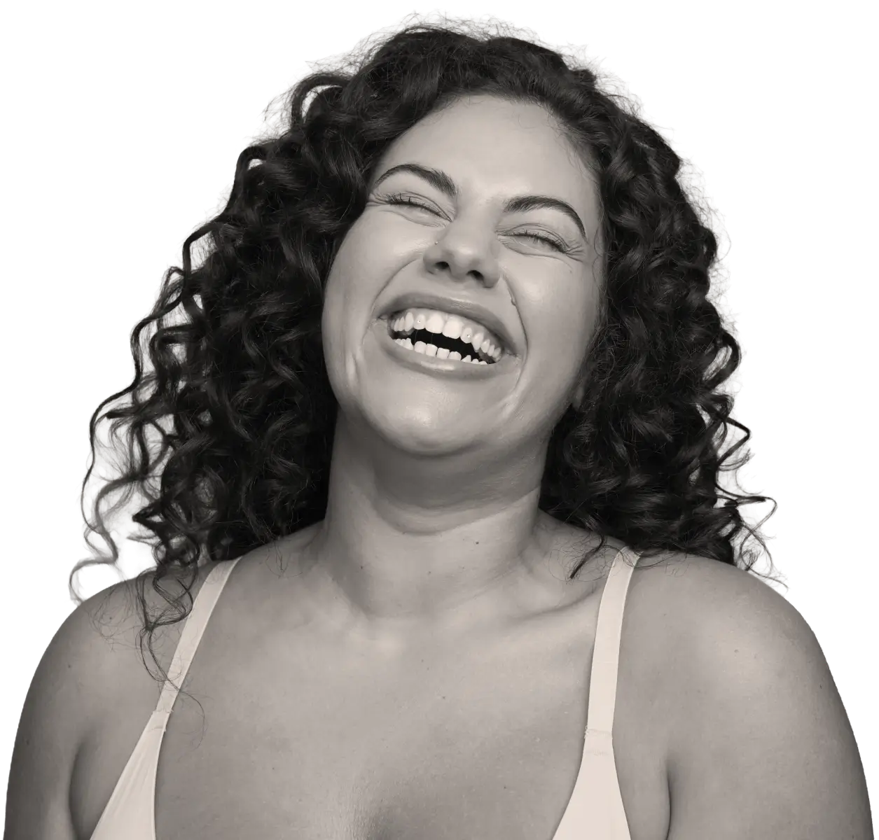 Healthy woman in her mid-40s smiling and looking to the side, lifestyle portrait.