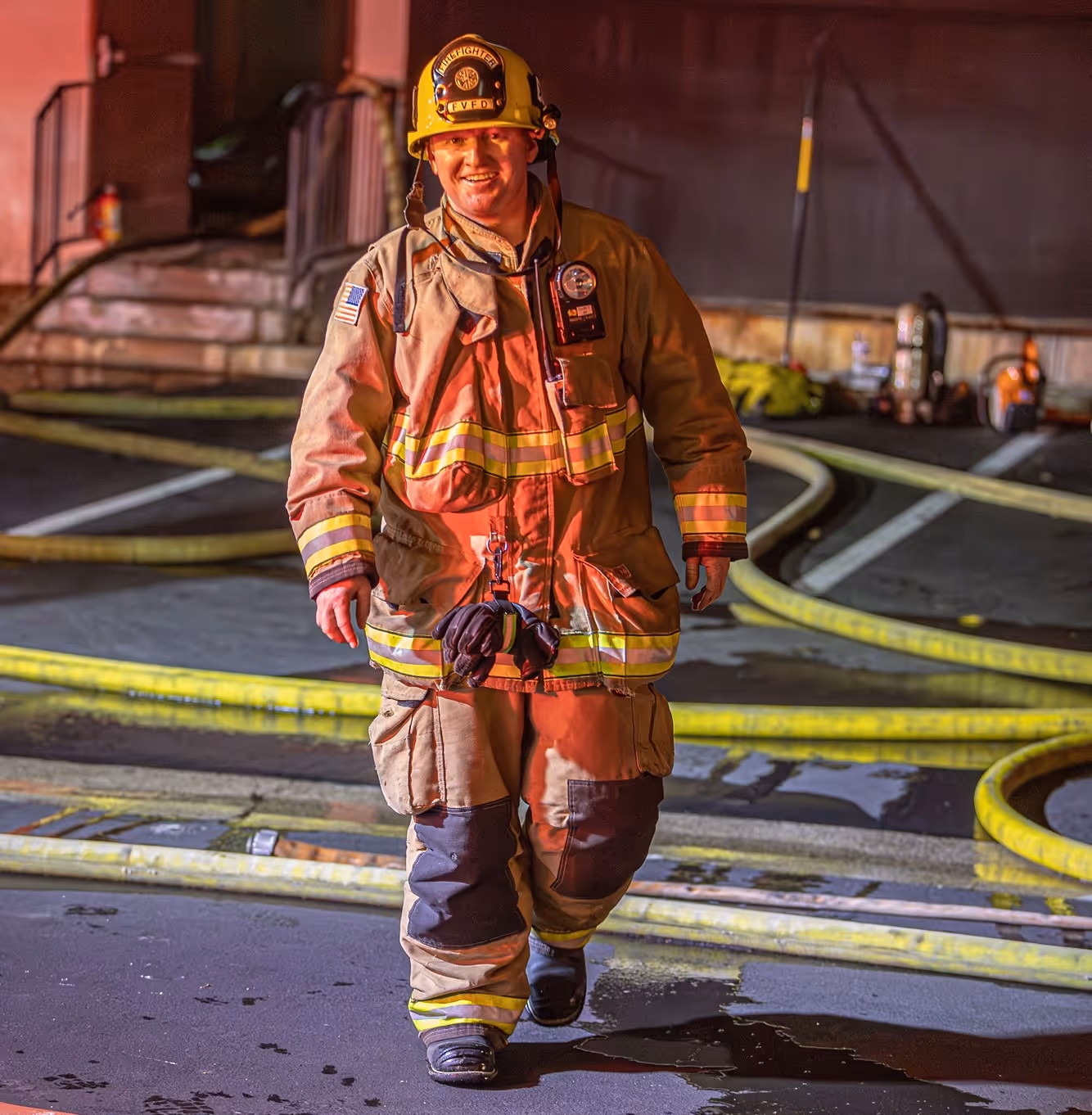Smiling police officer in uniform poses with two young girls in colorful jackets inside a store aisle.