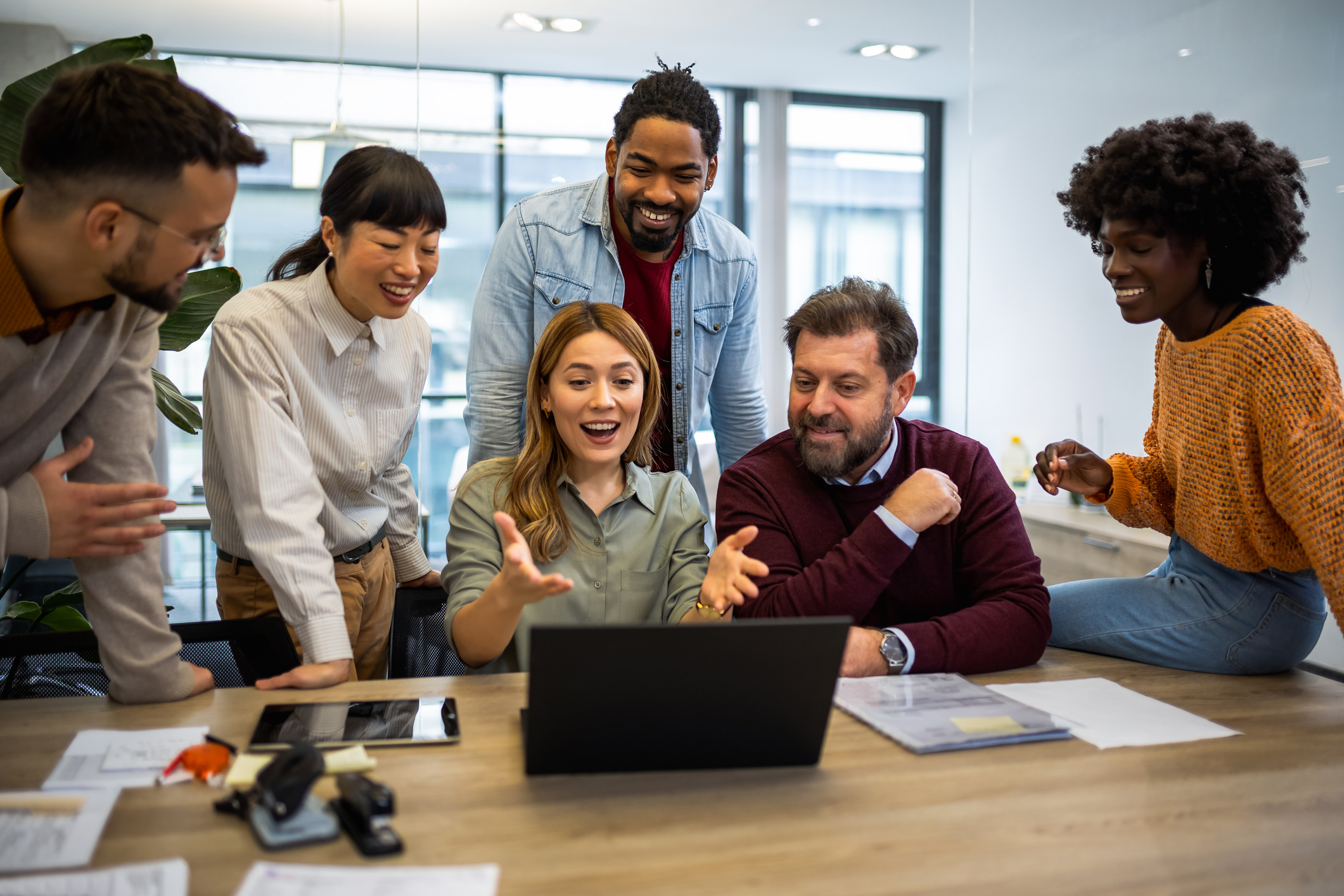 iStock 1859131541 Gen DiverseAdultsCollaboratingWithLaptop