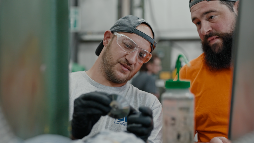 manufacturing worker performing routine maintenance