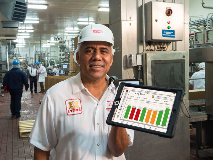 Lyon's employee holding iPad showing Redzone