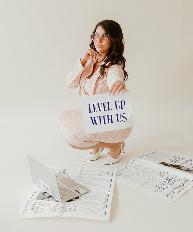 Woman holding Level up with us sign representing Social Circle Elite service