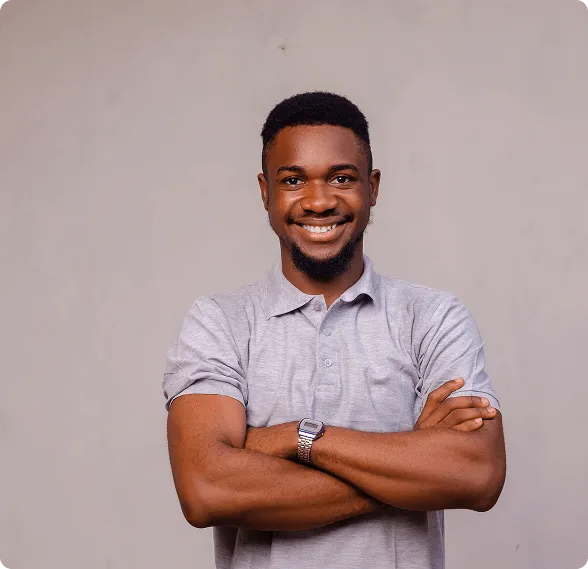 Smiling man sitting in a dental chair giving a thumbs-up in a bright dental office.