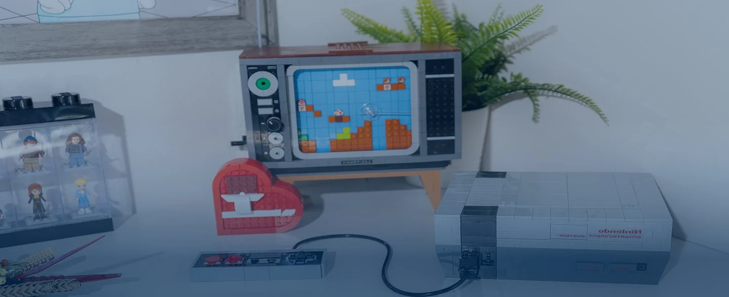Modern reception desk with marble countertop, two computer monitors, pendant lights, and large windows showing exterior building.