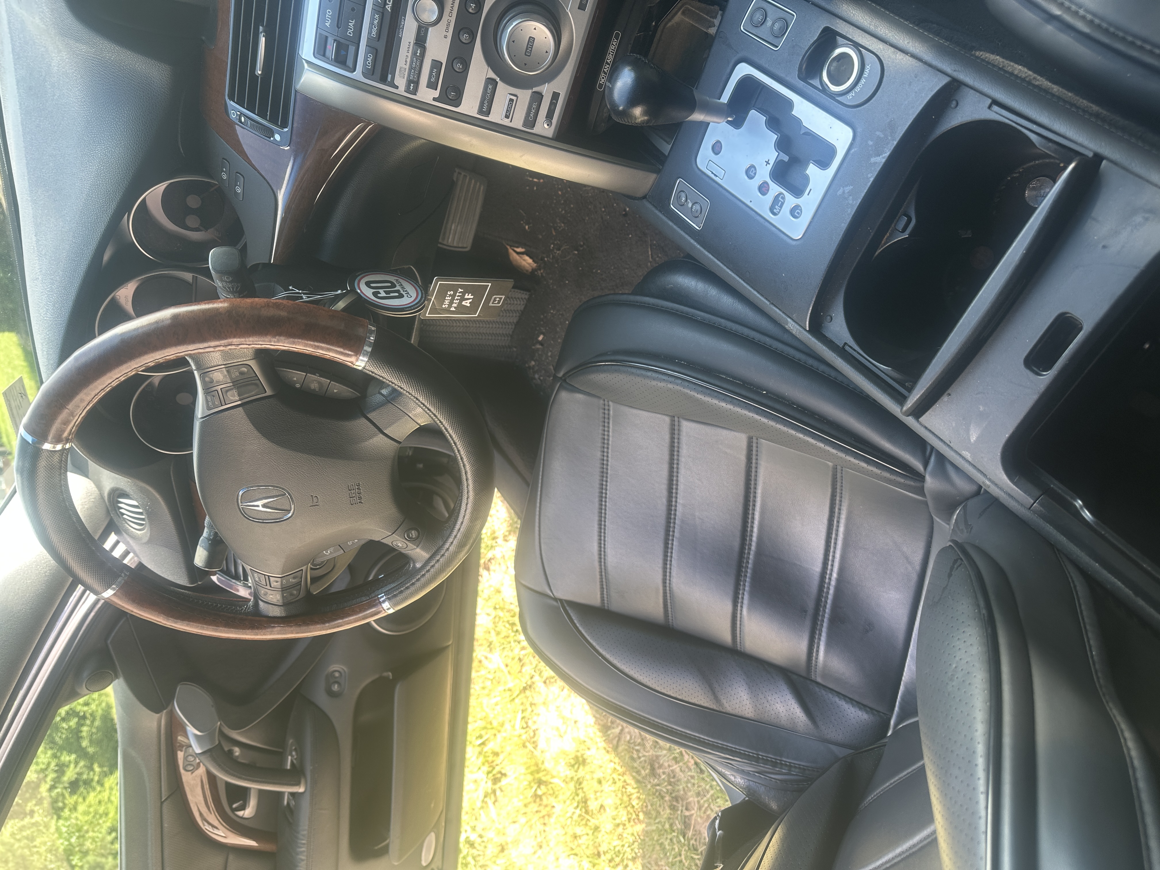 messy car interior before jxl auto detailing in Chester VA showing seats, center console, and floor mats