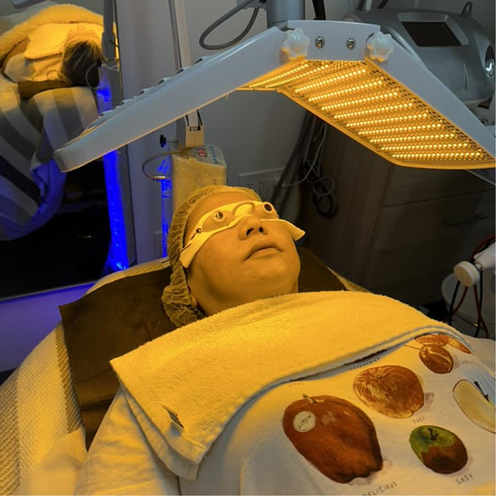 Healthcare professional holding a digital shield with a medical cross, representing secure, modern healthcare marketing services and digital solutions by Veewz.