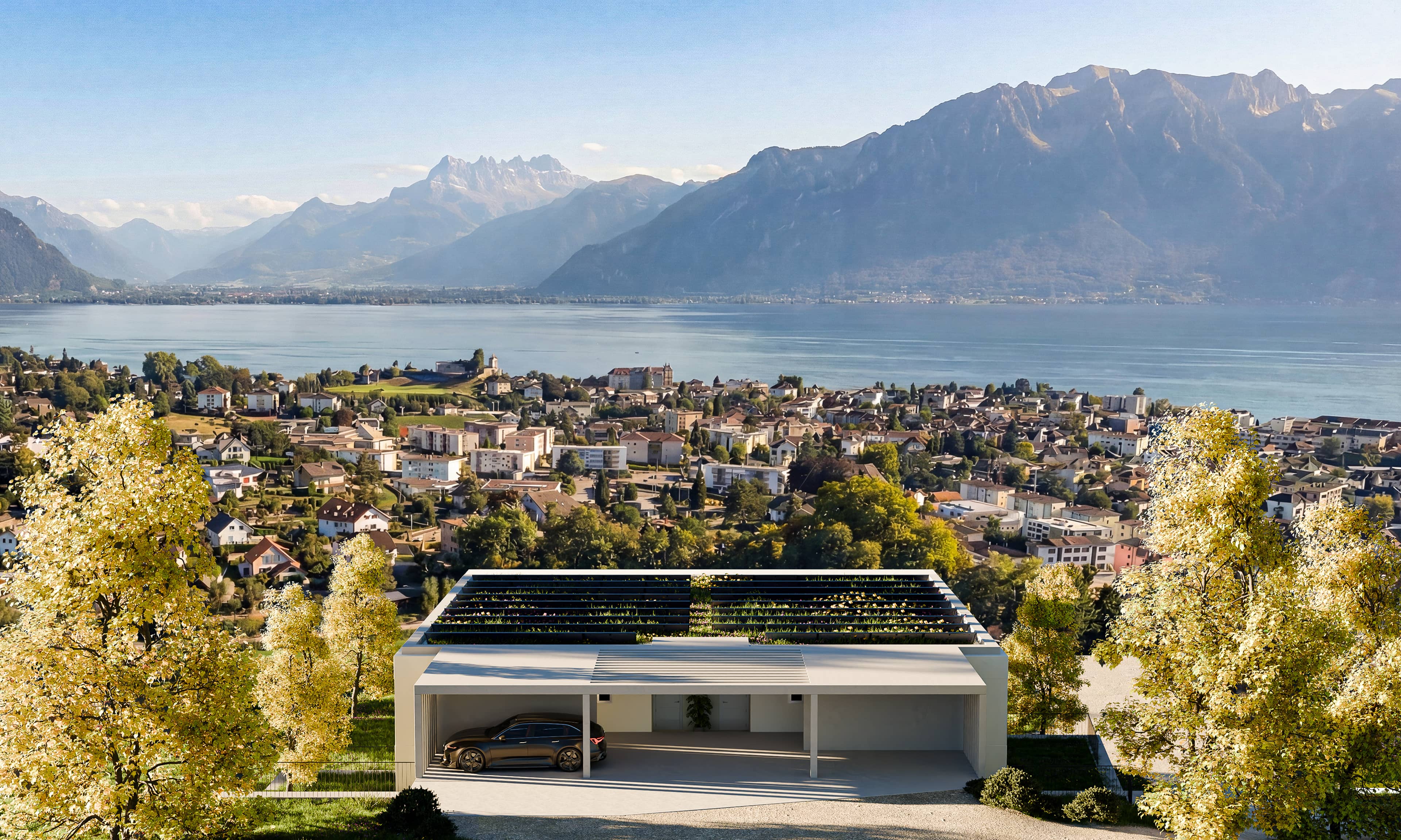 Maison moderne avec des panneaux solaires sur le toit, surplombant une ville, un lac et des montagnes lointaines sous un ciel bleu clair.