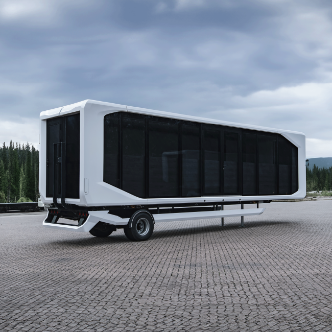 A large, elongated mobile unit is parked on a cobblestone lot, emphasizing rapid delivery capability with its ready-to-deploy design.