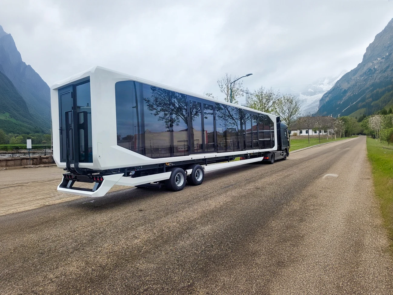 A Expandable Touchdown 53ft behind a truck in transport stand. 