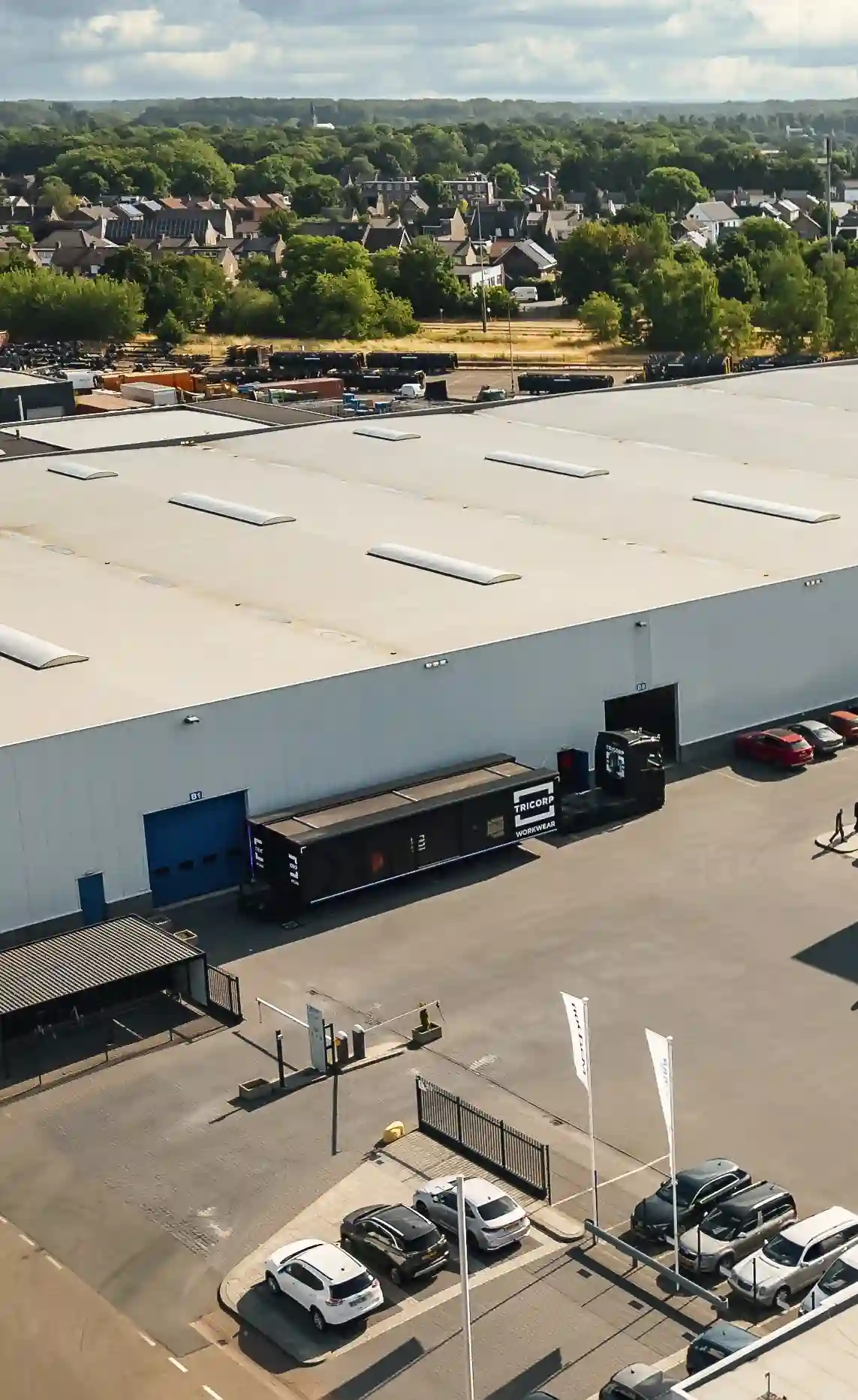 Aerial view of a mobile fitting room unit parked on premises, showcasing the compact and transportable design.
