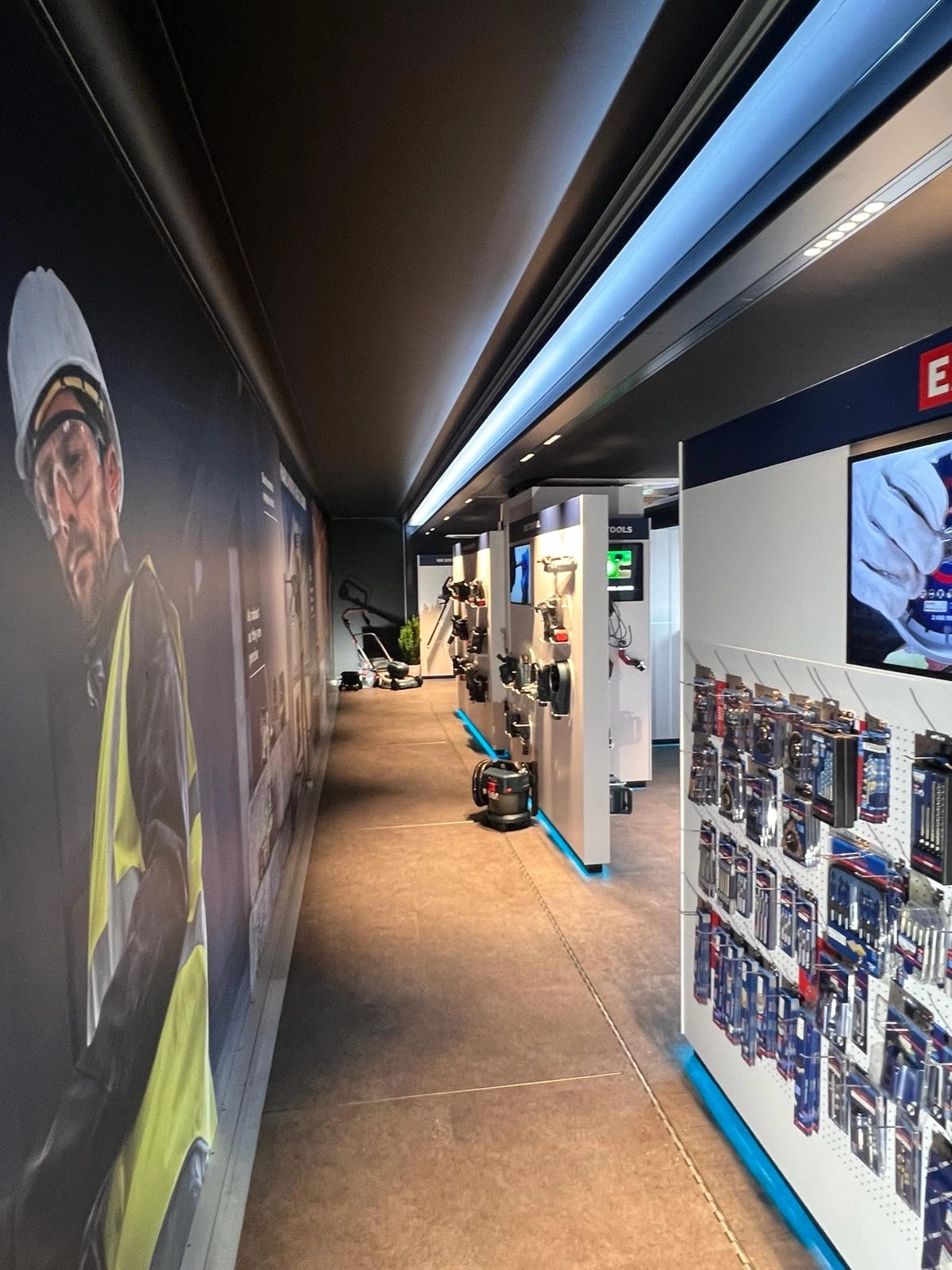 Interior view of a modern mobile pop-up space featuring eclectic furniture with a classic black armchair