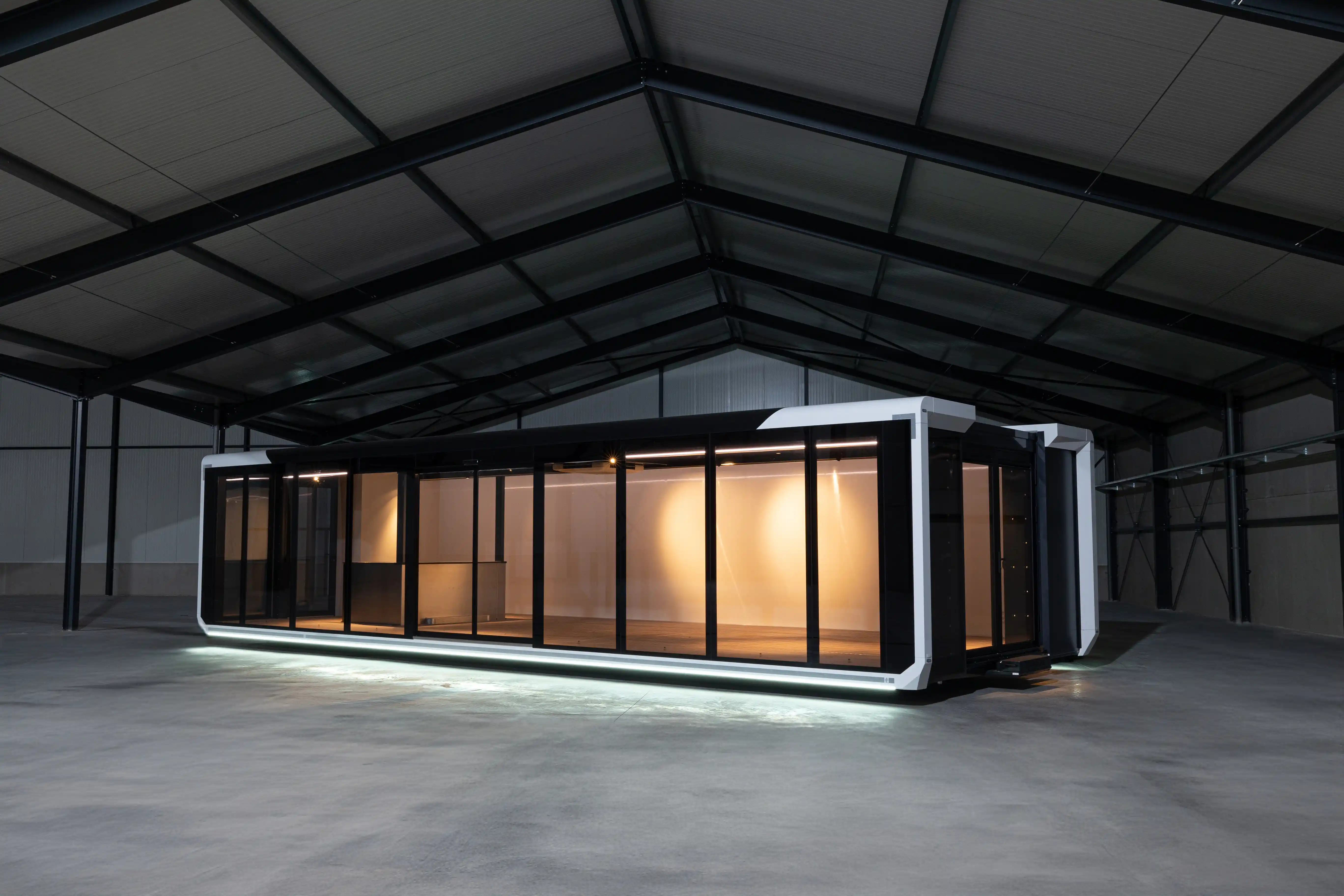 Fully expanded Expandable Hybrid unit with lights highlighting the spacious interior.