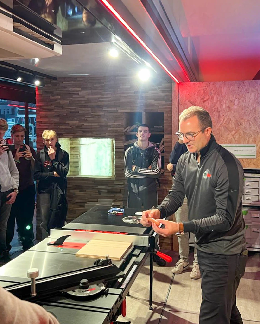 A mobile battery service center trailer from Autocraft with the branding 'REVIVE Mobile' parked outside, featuring a side graphic detailing EV Battery Service Centre functions including testing, repair, and remanufacture.