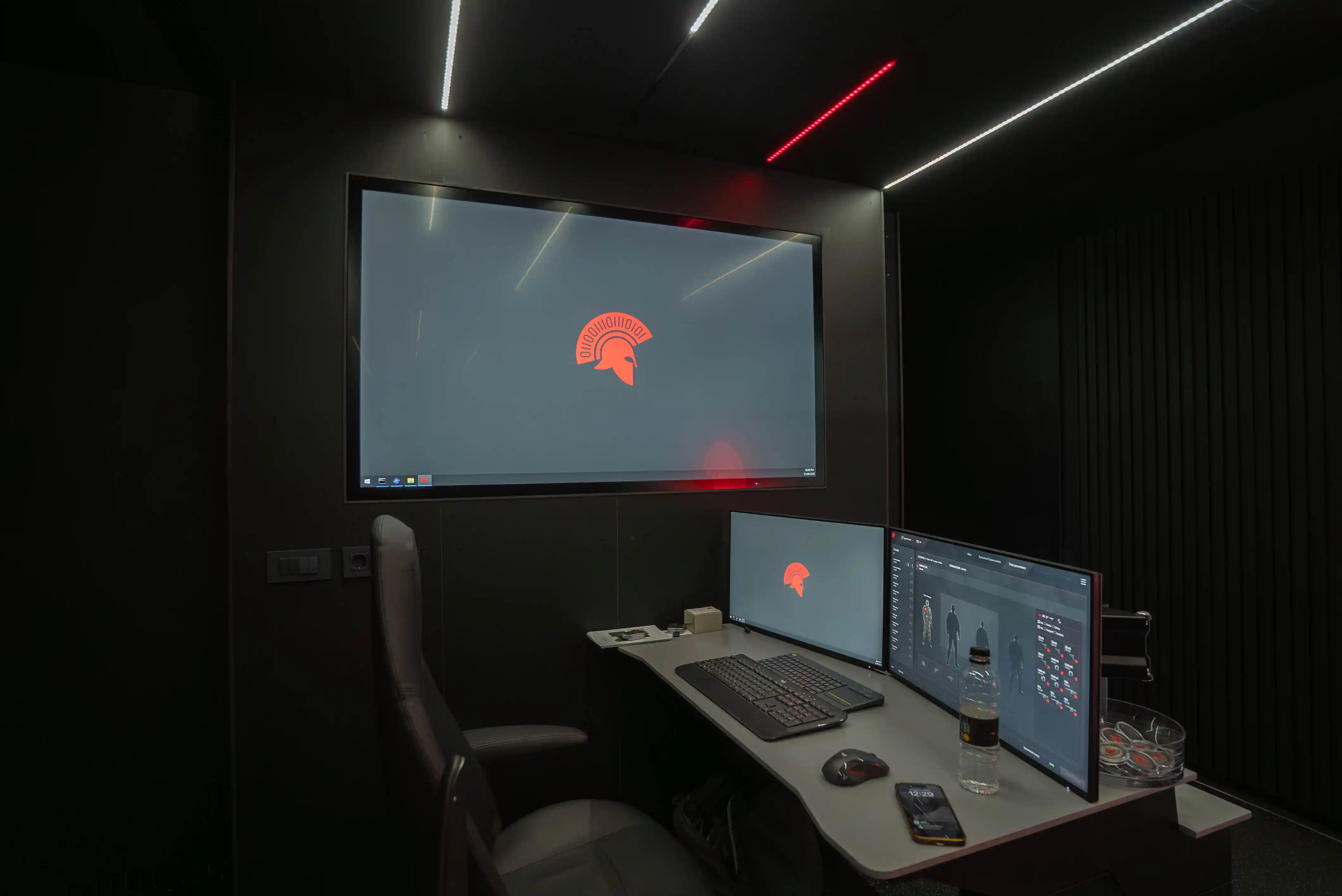 Instructor station inside the MTC with GUARD™ control panel and After Action Review interface.