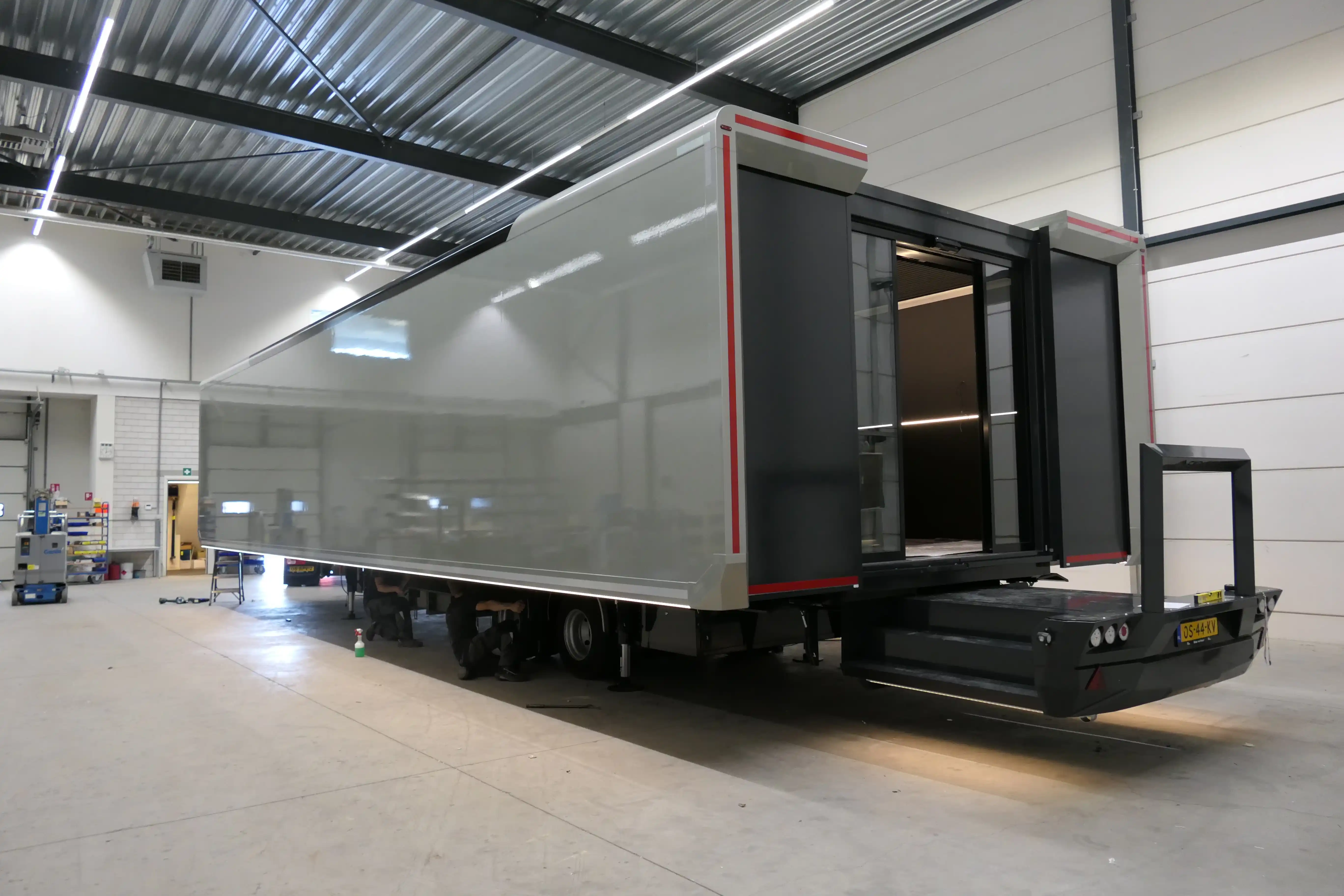 Expandable restroom trailer with hydraulic leveling, providing a stable and customizable hygiene solution for festivals and corporate events