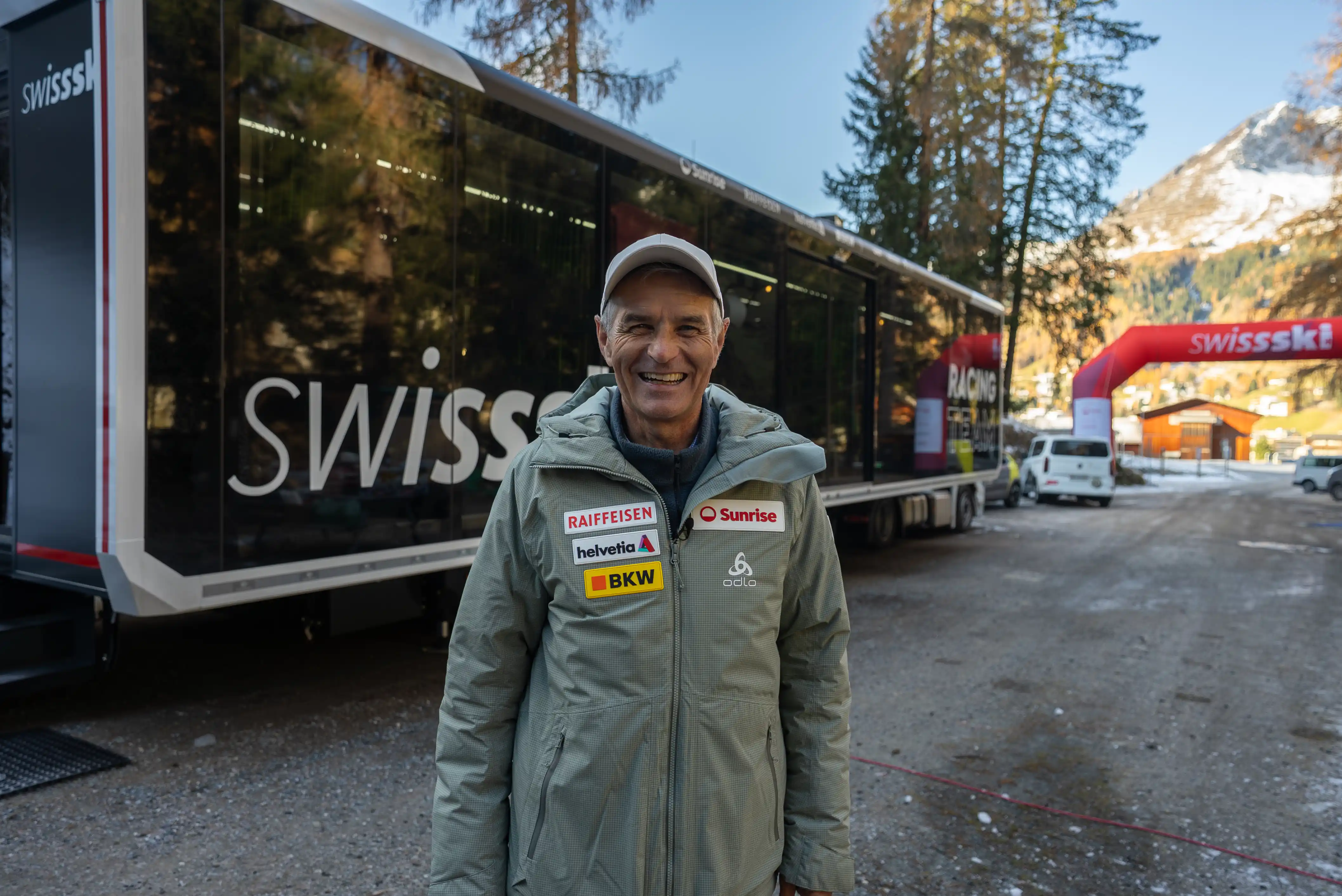 Jurg Capol next to an Swiss-ski wax expandable trailer.Swiss-Ski’s Expandable Trailer in action, used as a mobile wax and team workspace during international winter sport events.
