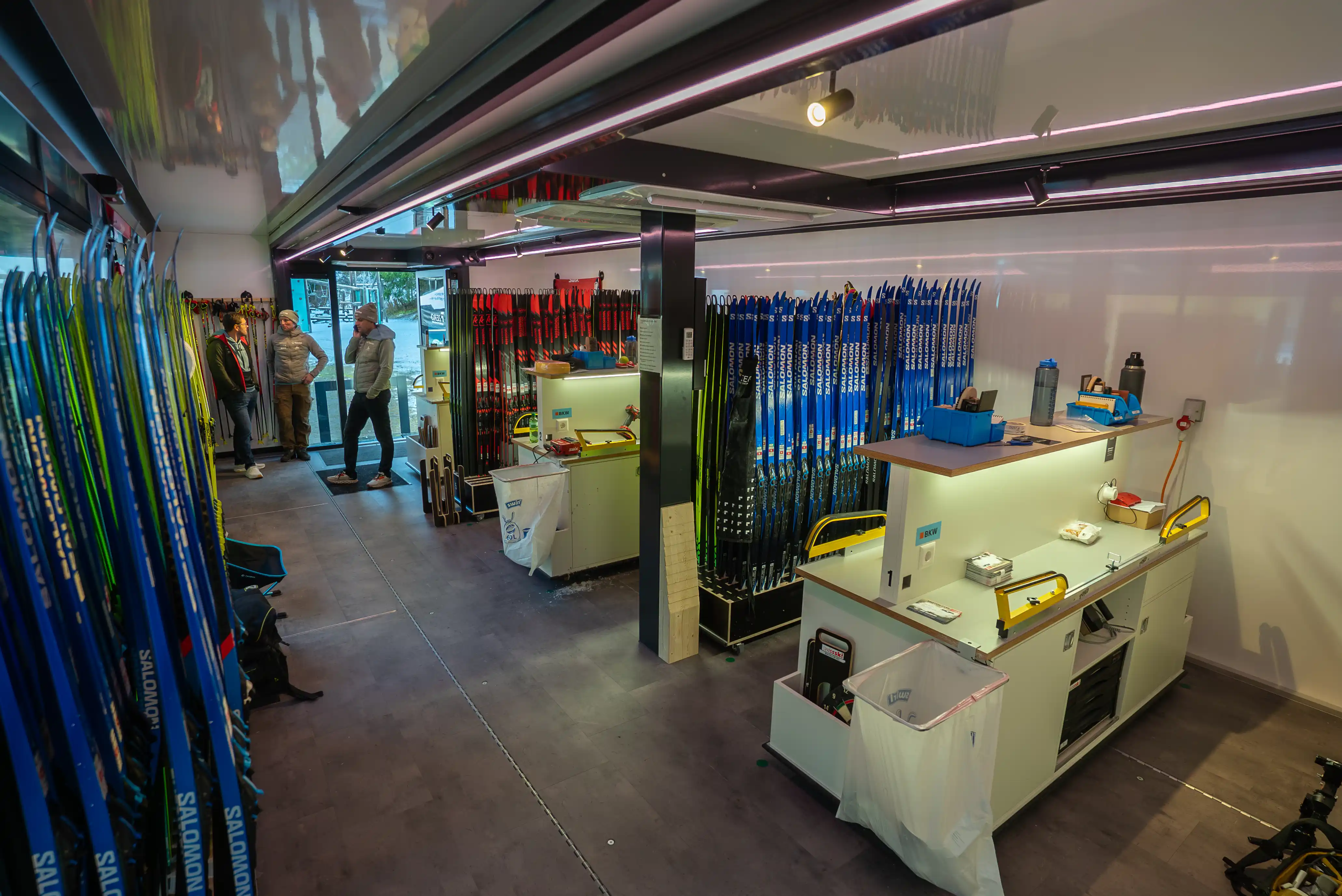 Interior view of the Expandable Trailer with working stations, storage, and team meeting space for Swiss-Ski’s service staff.