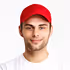Smiling young man wearing a red cap and white t-shirt on a white background.