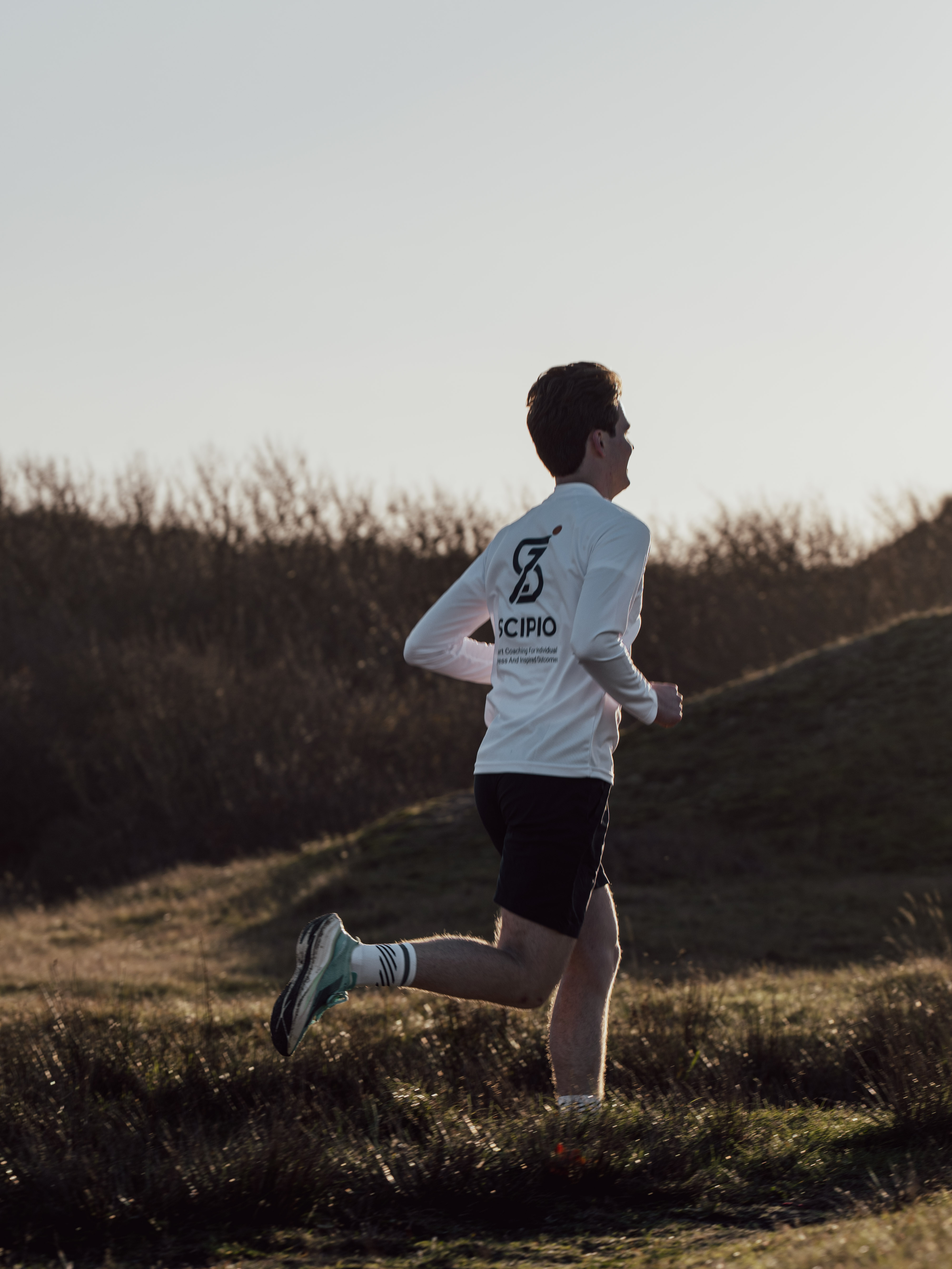 SCIPIO running through the dunes with sunset