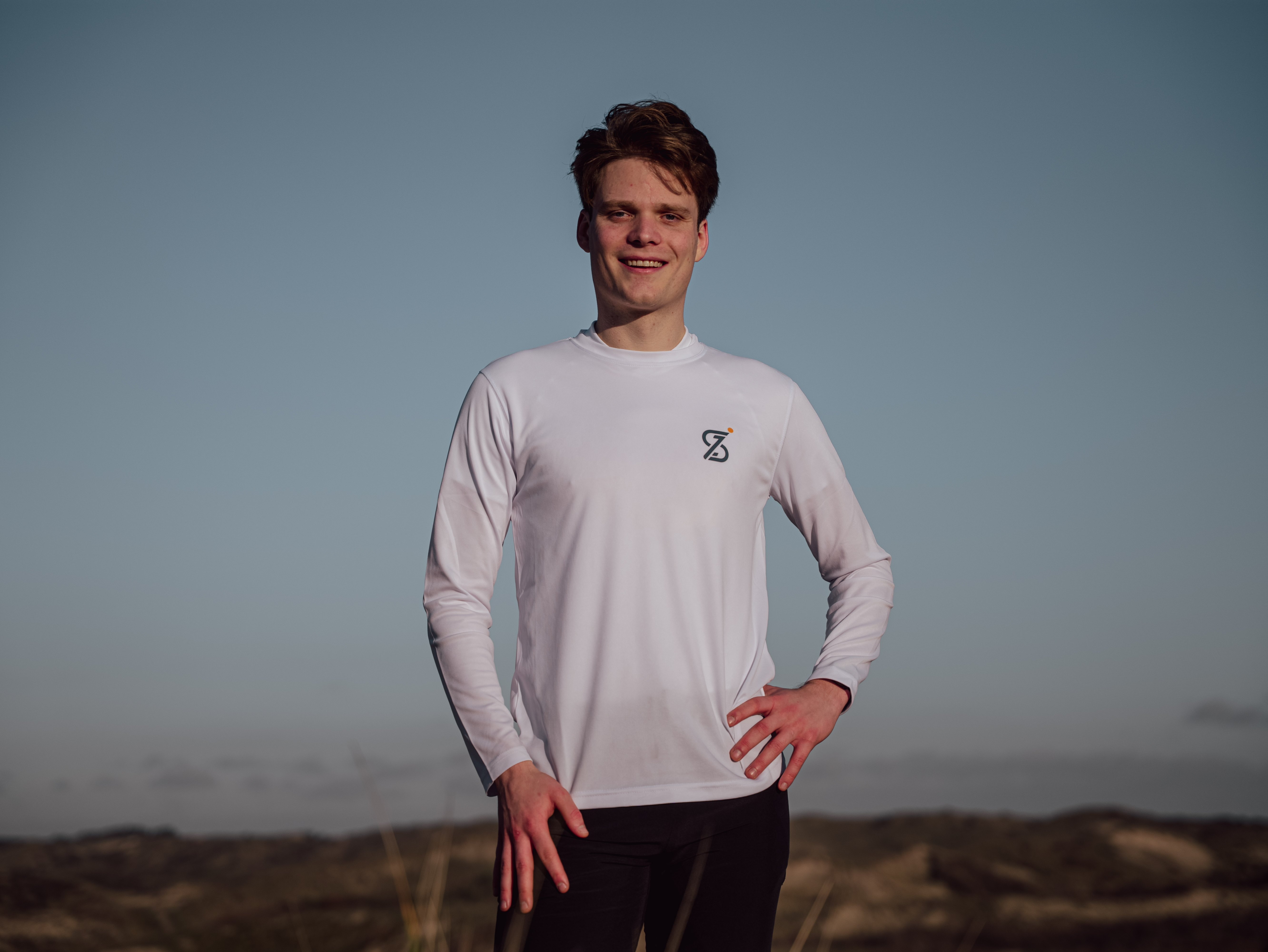 SCIPIO standing on top of the dunes with the horizon in the background