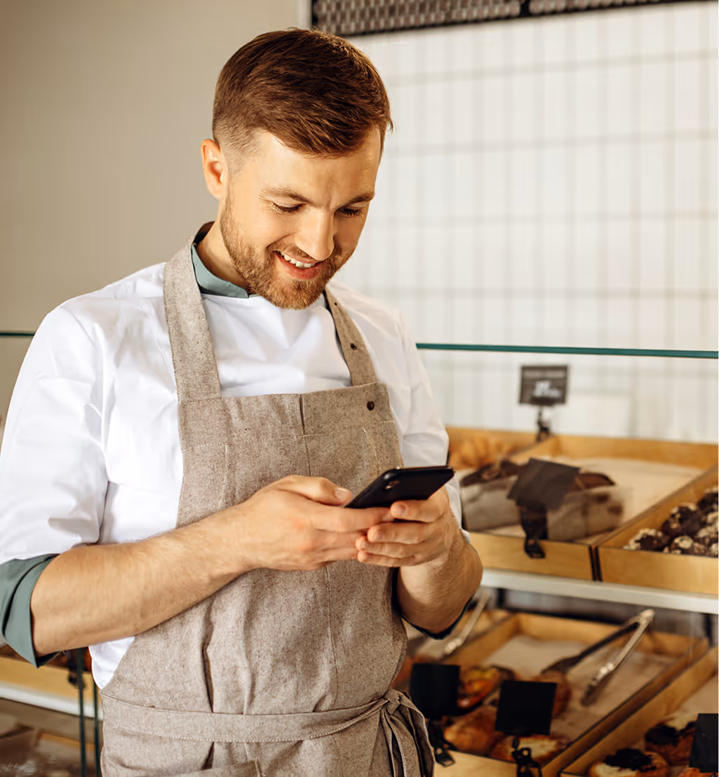 A man redeeming earned points on the mobile phone.