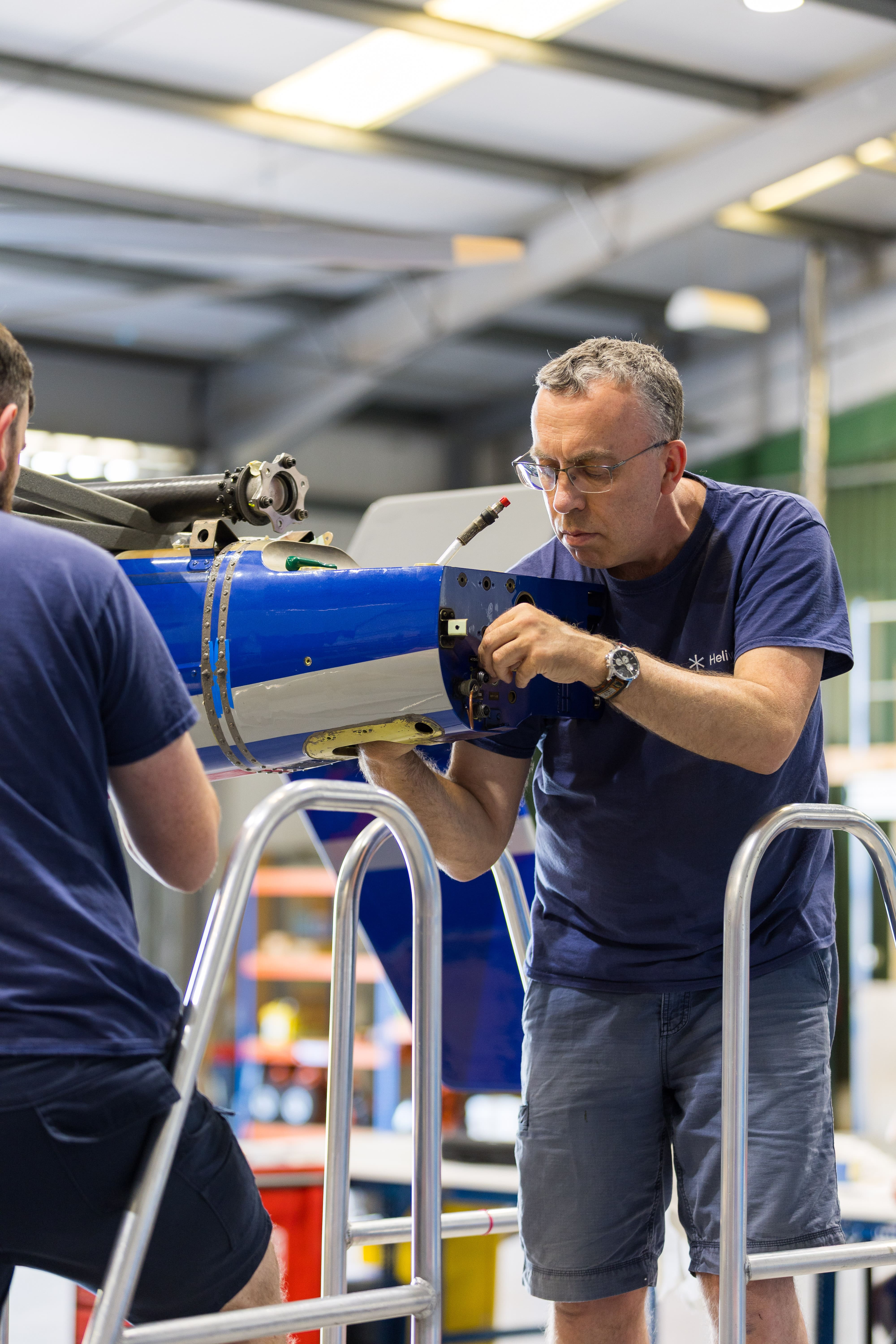 image of maintenance crew working on aircraft