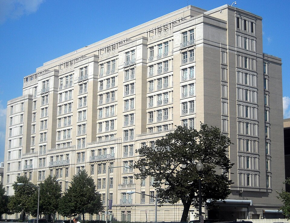 image of a volunteer mentoring teenagers in a tech workshop