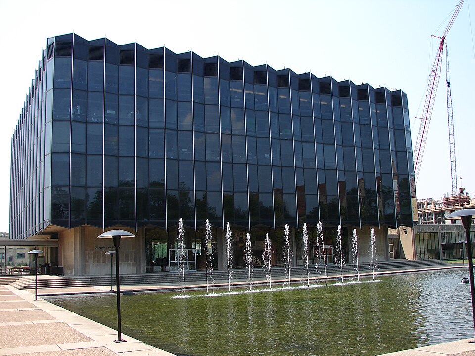 image of a volunteer mentoring teenagers in a tech workshop