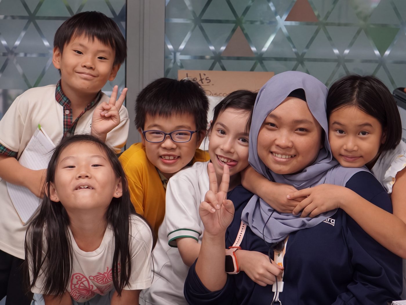 Agora Student Care children with their educator at Fragrance Empire Building, Alexandra Road